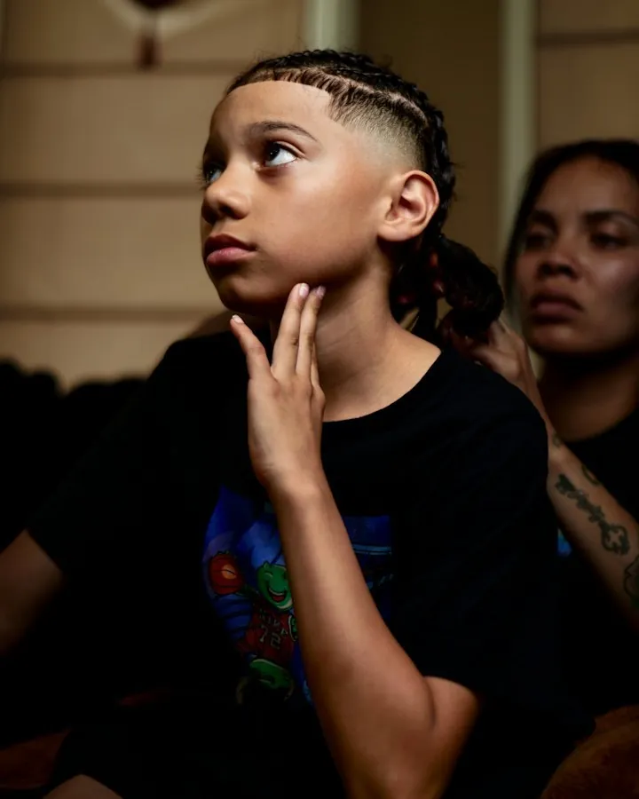 Young person with fresh cornrows