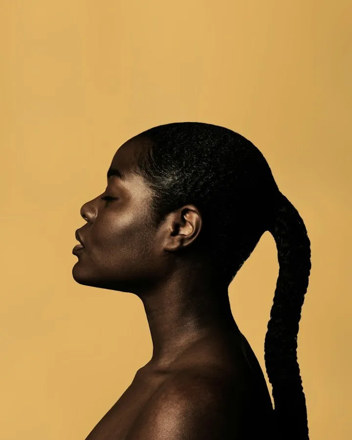 Profile of a woman with a sleek braided ponytail